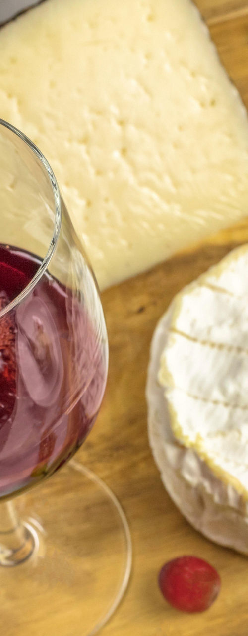 Red wine pouring with cheese and bread