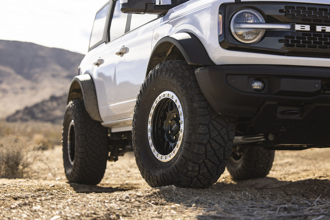 2021 Ford Bronco Raptor - KMC GRENADE DESERT BEADLOCK - Black | KMC Wheels