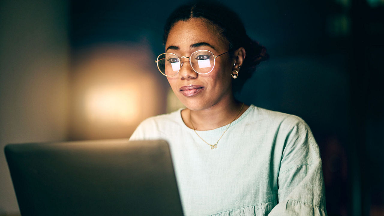 A Woman Typing on a Laptop - People
