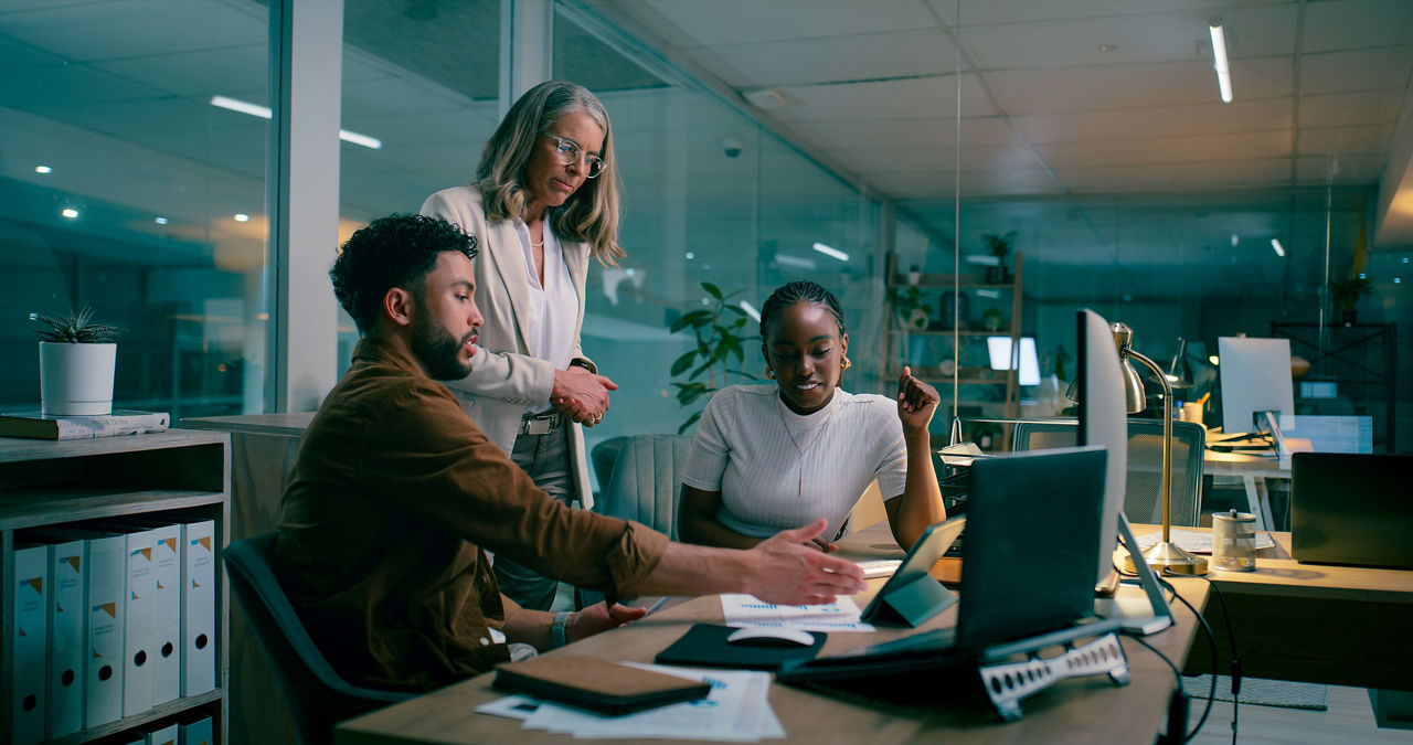 Colleagues in the office looking at a tablet