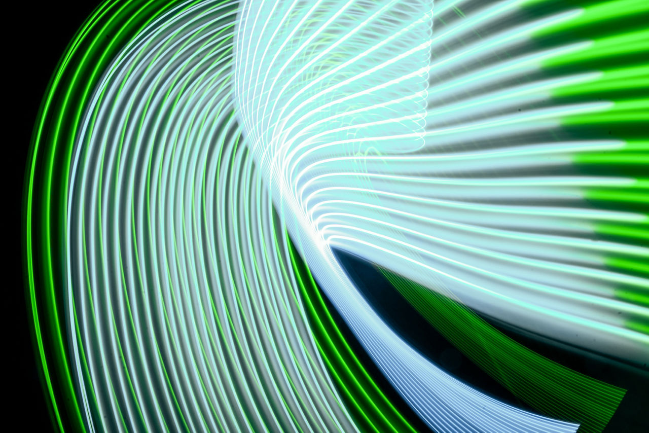 Digital blue and green lines on black background
