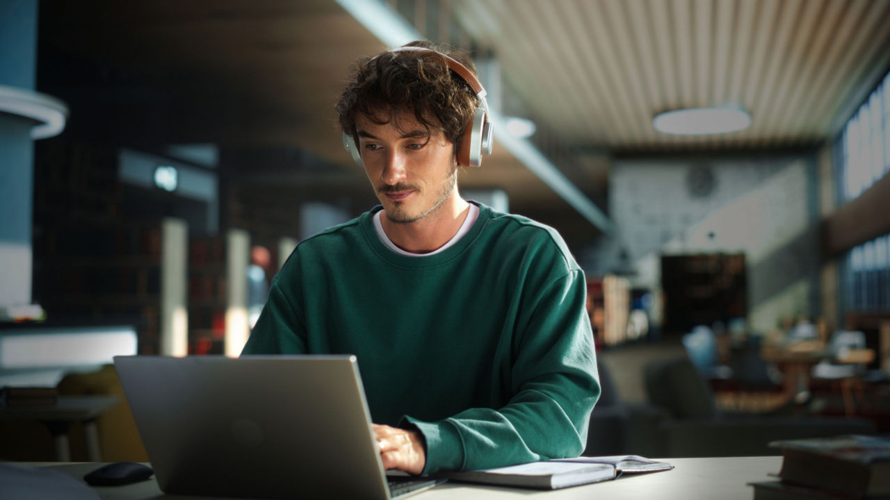 Male Student on Laptop Computer