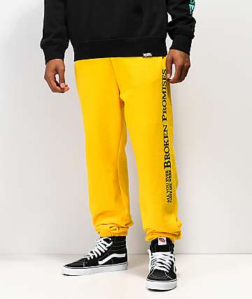 Broken Promises Bad Behavior pantalones deportivos dorados
