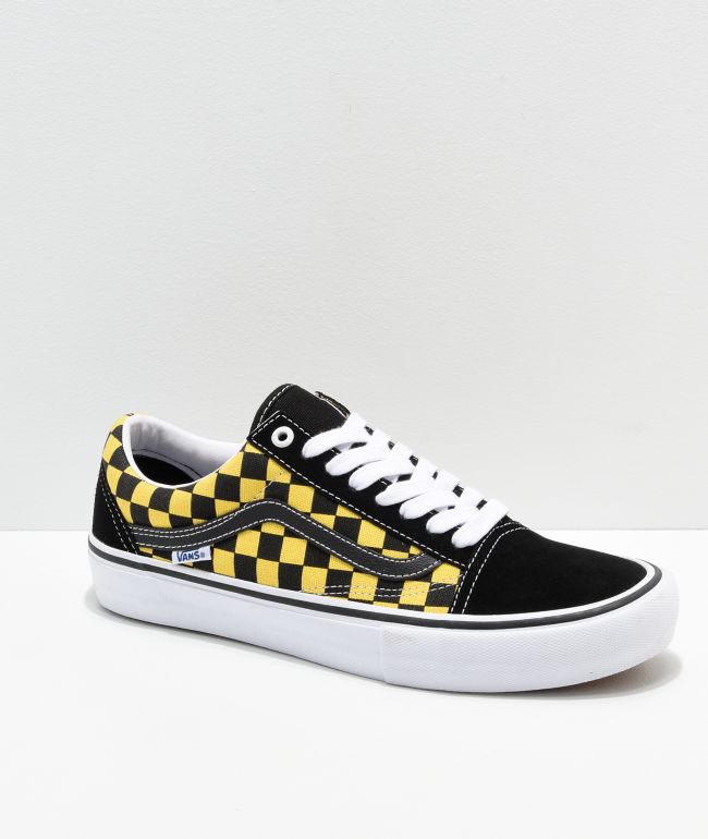 black and white checkered vans with yellow
